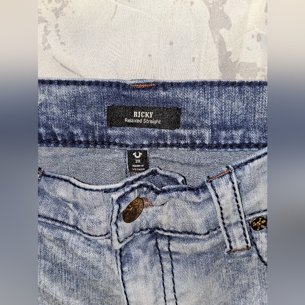 Acid washed True Religion blue jeans